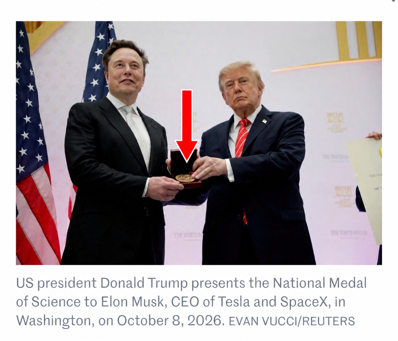Trump and Musk holding a medal, with a red arrow pointing to it